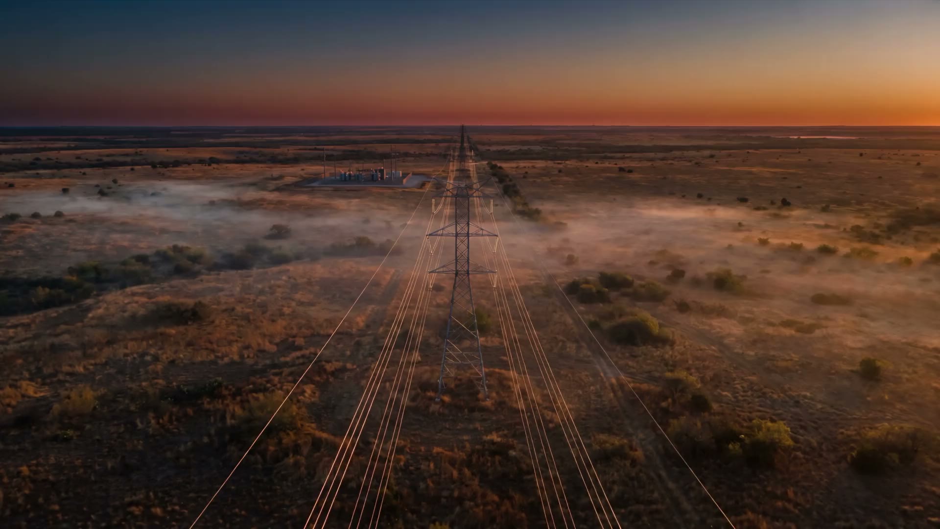 Dawn over a high-voltage transmission corridor in Texas